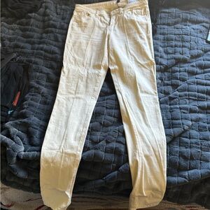 Yellow Cream colored Guess Jeans.